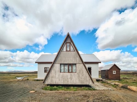 triangular-shaped-scandinavian-wooden-house-among-2025-03-26-13-28-19-utc (1).jpg