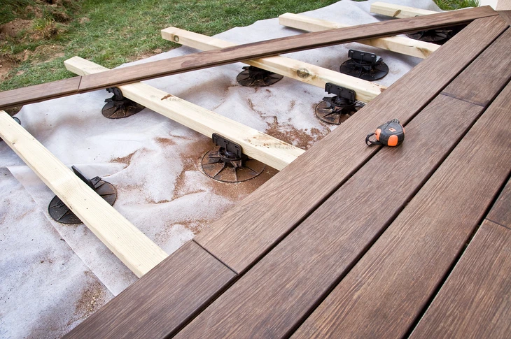 Construction of a wooden terrace in a garden